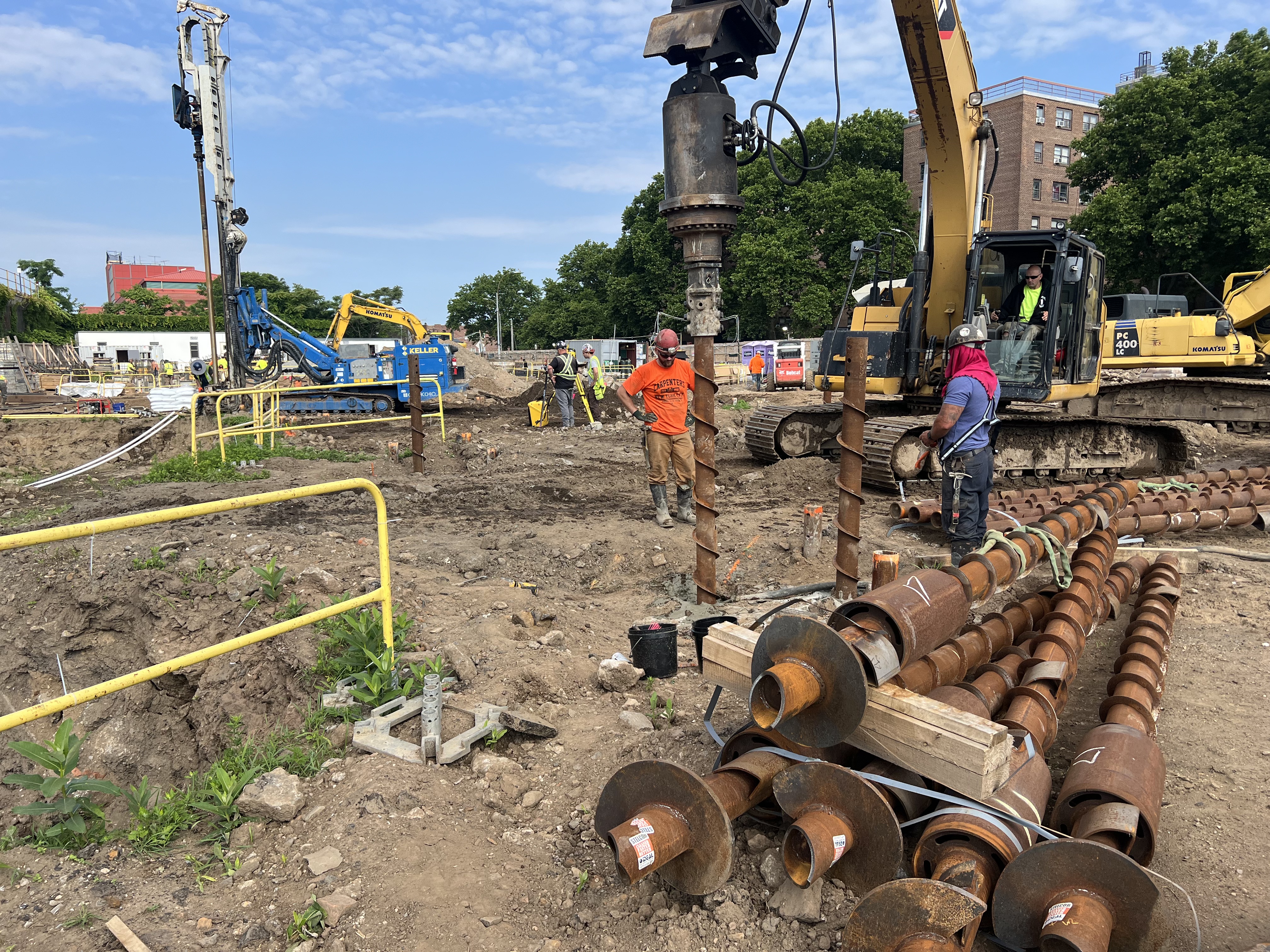 Deep foundation installation at an active construction site