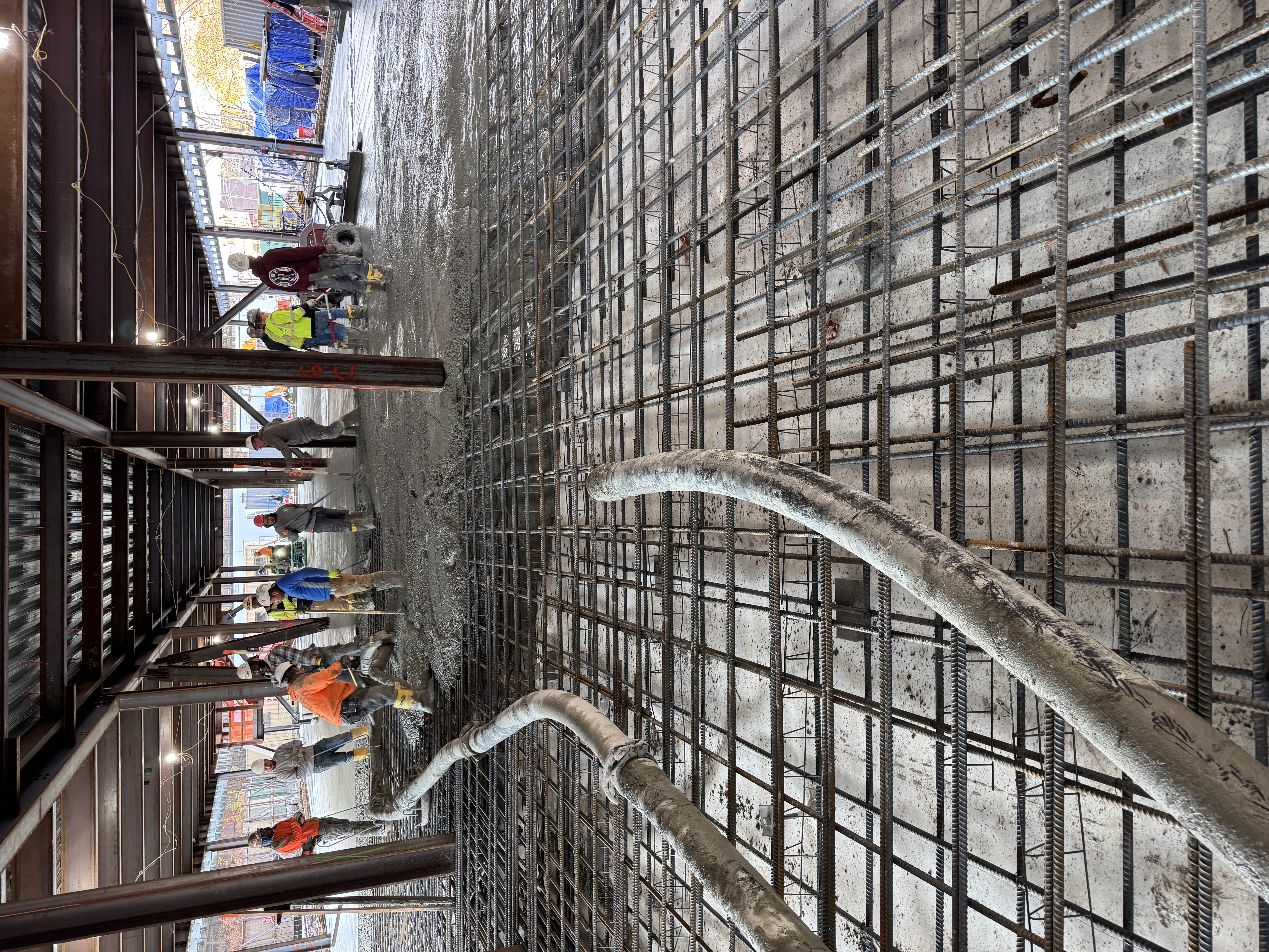 Reinforced concrete placement with formwork and reinforcement visible