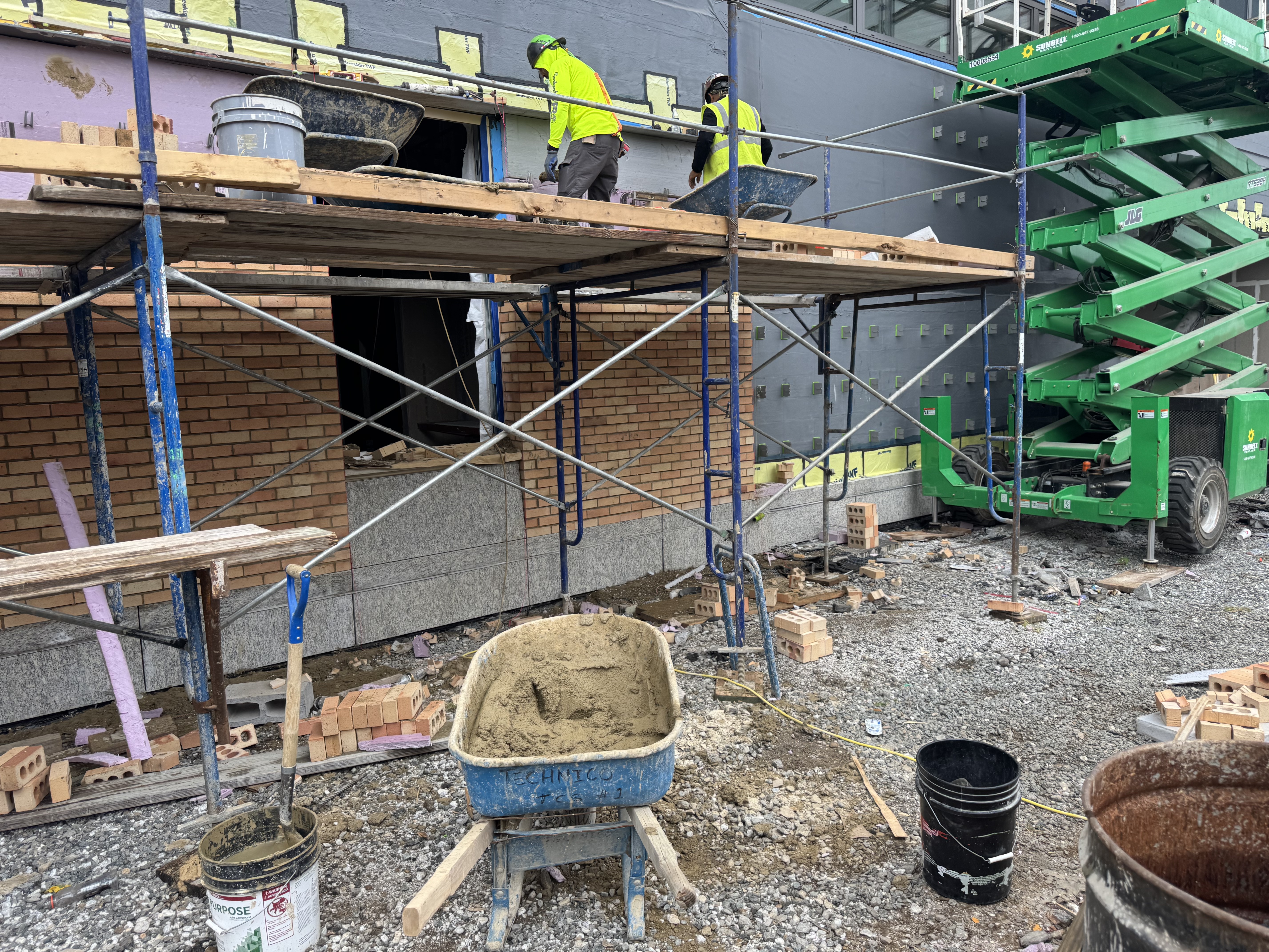 Masonry facade quality review during exterior construction work